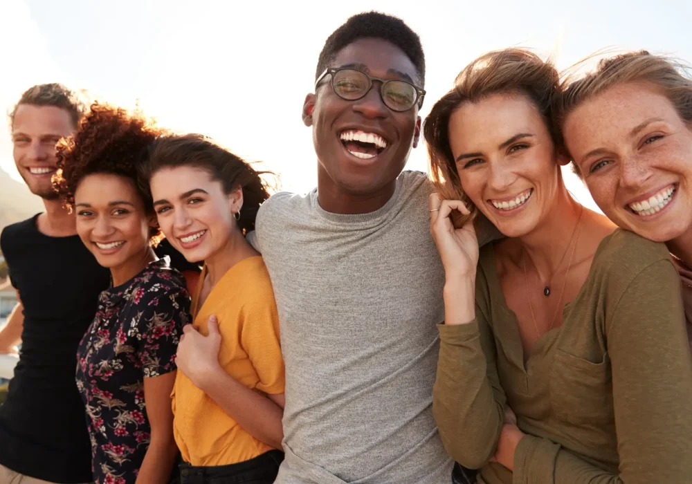 Portrait,Of,Smiling,Young,Friends,Walking,Outdoors,Together